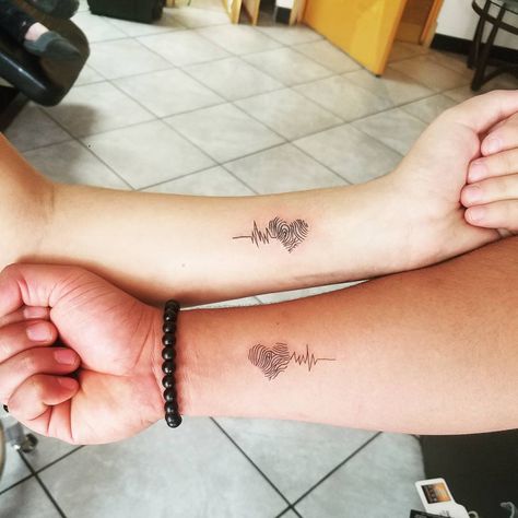 37 Matching Tattoos For Couples Who Want to Make a Small Statement Fingerprint Tattoo Ideas, Thumbprint Tattoo, Fingerprint Tattoo, Fingerprint Heart Tattoos, Tattoo Ideas For Couples, 27 Tattoo, Fingerprint Tattoos, Him And Her Tattoos, Mother Son Tattoos