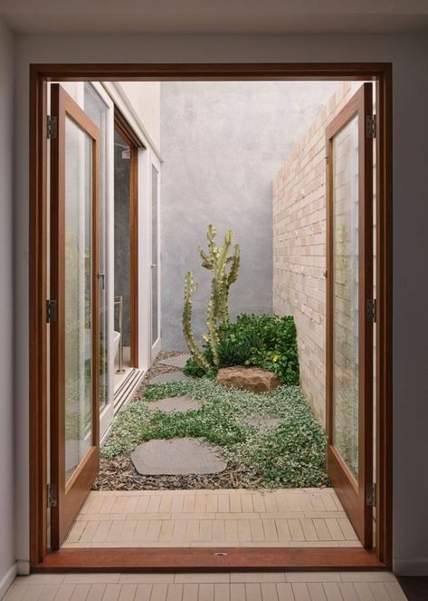 From inside to outside, and internally through a series of private courtyards, there is always an opportunity to engage with the natural environment. Roof plantings are also designed to sprawl and grow over the structure. “The intention eventually is for the building to be dominated and returned to the landscape over time,” he says. #privategarden #courtyard #gardendesign #landscaping #familyhome #homedesign #homedesignideas #architecture #houseplants Small Courtyard, Louvered Shutters, Clad Home, Internal Courtyard, Casa Patio, Masonry Wall, Australian Architecture, Storey Homes, Patio Interior