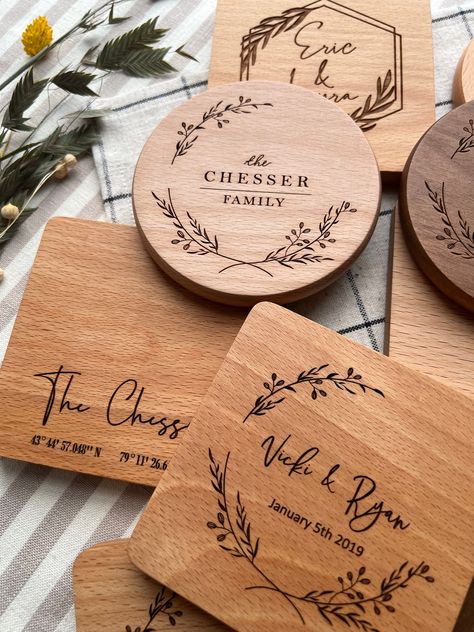 A set of premium quality wood coasters, engraved to keep special memories always within reach.  Protect surfaces and make any drink meaningful with our personalized coasters. Made from natural wood, and engraved by us with a custom design created to your liking. They make the perfect gift for any occasion--commemorating a wedding, an anniversary, or a new home-- that your loved ones can enjoy every day.  Each piece is crafted with the utmost care: engraved by a precise CO2 laser machine, and pol Pyrography Wedding Gift, Wood Burned Wedding Gift, Wedding Gift Coasters, Engraved Wood Ideas, Small Laser Engraving Ideas, Wood Etching Ideas, Laser Machine Ideas, Laser Engraved Wedding Gifts, Wedding Engraving Ideas