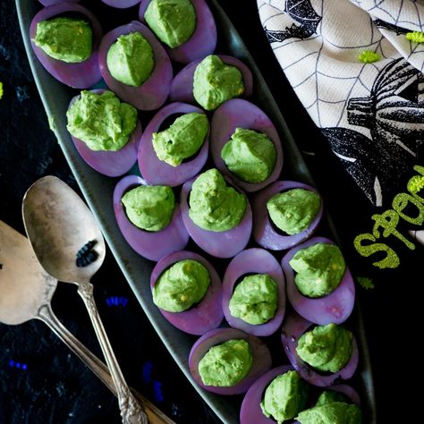 Goth Appetizers, Beatle Juice Movie Night, Beetlejuice Food Ideas Appetizers, Spooky Veggies For Halloween, Beetle Juice Dinner Ideas, Purple Deviled Eggs, Oogie Boogie Food, Halloween Delved Eggs, Bettle Juice Party Food