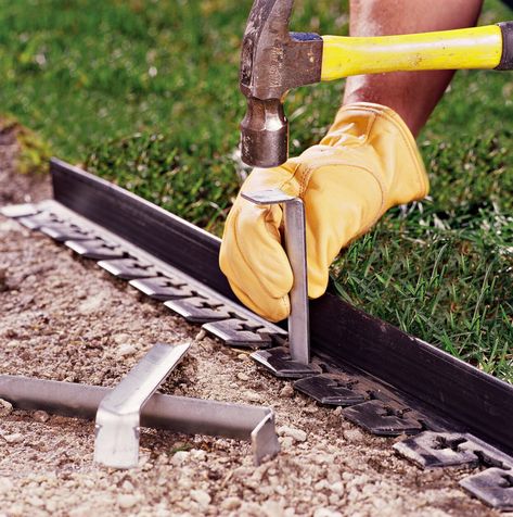 pounding-stakes-walkway-border-b03d0b52 Diy Stone Walkway, Paver Walkway Diy, Pavers Walkway, How To Lay Pavers, Paver Edging, Flagstone Pathway, Gravel Walkway, Flagstone Pavers, Wood Walkway