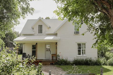 We bought the house two years ago come August, had three weeks to renovate and move in, and have been working on her ever since. The front door was a spare Pop had from a job, the porch was built from leftover deck materials that were warped. The stone path was made by foraging down by the river and loading stones back and forth with Ma and the kids. The lawn was a dirt pit and took hours upon hours of raking, sifting, adding new dirt, seeding, adding more dirt, and patience. The upstairs sin... Old House With Character, Coming Home Aesthetic, Farmhouse In The Woods, Old Farmhouse Exterior, Cottage Farmhouse Exterior, Small Ranch House, Farmhouse Exterior Paint Colors, Single Pane Windows, Renovated Farmhouse