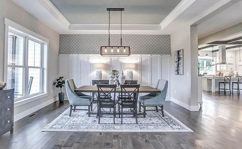 Dining room with gray tray ceiling and wood flooring and white wall paneling Tray Ceiling Paint Ideas, Tray Ceiling Paint, Tray Ceiling Ideas, Kitchen Dining Room Combo, White Wall Paneling, Open Living Room Design, Grey Ceiling, High Ceiling Living Room, Ceiling Design Ideas