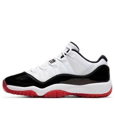 The Air Jordan 11 Retro Low GS 'Concord-Bred' is a must-have for any sneakerhead. This shoe combines two of the most iconic OG colorways, and is sure to turn heads whenever you wear them. The white leather upper is reminiscent of the 'Concord' Jordan 11, while the black patent leather overlay gives it a unique twist. The foam midsole provides excellent cushioning, and the semi-translucent red rubber outsole makes this shoe pop. (SNKR/AJ11/Low Top/Basketball) Black Jordan 11, Jordan 11 Red, Air Jordan 11 Retro Low, Jordan 11 Low, Black Jordans, Pretty Shoes Sneakers, Jordan 11 Retro Low, Air Jordan 11 Retro, Jordan 11 Retro