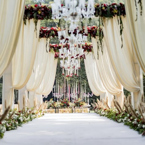 Enter a realm of timeless elegance with our white-themed decoration at the entrance, where simplicity meets sophistication. The pristine white decor elements create a serene and inviting atmosphere, setting the tone for a memorable celebration. From cascading floral arrangements to delicate drapery and soft lighting, every detail is meticulously designed to enchant and captivate. As you step through this elegantly adorned entrance, you embark on a journey into a world of beauty and romance, m... Wedding Entrance Arch Decor, Pathway Decor Wedding, Wedding Passage, Mandap Setup, Reception Entry, Event Entrance Arch, Entry Arch, Nikkah Decor, Wedding Walkway