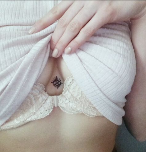 Tiny underboobs tattoo Small Evil Eye Sternum Evil Eye Tattoo, Evil Eye Tattoo Sternum, Sternum Eye Tattoo, Evil Eye Chest Tattoo, Ignorant Tattoo, Arabic Tattoos, Birthday Tattoos, Sternum Tattoos, Third Eye Tattoos