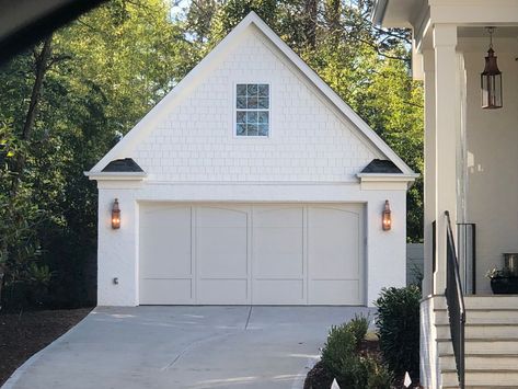 Garage Same Color As House, White House Exterior Garage Door, Cottage Style Garage Doors, Garage Doors White Brick House, Revere Pewter Garage Door, White House Painted Garage Door, White House With Garage Door, Taupe Garage Door White House, Sage Garage Door