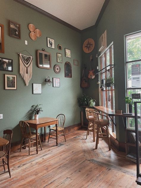 Green Wall House Interior Design, Green Wall Coffee Shop, Sage Green Walls Dark Floors, Coffee Shop Green Design, Medium Green Walls, Safe Green Walls, Sage Green Living Room Furniture, Earthy Green Living Room Walls, Dark Wood And Sage Green