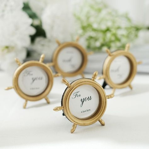 PRICES MAY VARY. Quantity: 4 Mini Photo Frames Material: Resin Color: Gold Frame Style: Ship Wheel Overall Size: 3.5"L x 3"W Photos Size: 1.75" Dia. Number Of Spokes: 6 Features: Sturdy, Durable, Portable and Lightweight They are equipped with backing to fit your favorite photos Easel on the back for the frame to stand on it's own Multi-Use: Picture Frame, Place Card Holder, Photography Prop and more! Safe Material: These frames are light but firm, have resin body instead of glass. When they fal Yacht Wedding Decor, Nautical Wedding Centerpieces, Nautical Wedding Favors, 4 Picture Frame, Round Picture Frames, Nautical Birthday Party, Mini Photo Frames, Nantucket Wedding, Nautical Themed Party