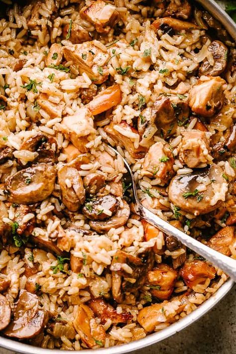 This one pot Chicken and Rice with Mushrooms recipe is smooth, creamy, hearty comfort food at it’s best. A tasty and complete meal in one pan! #chickenandrice #mushrooms #dinnerideas Rice Comfort Foods, Turkey With Mushrooms, Chicken And Mushroom Recipes Skillet, One Pot Hearty Meals, One Pot Chicken Mushroom Rice, One Pot Mushroom Chicken And Rice, Chicken With Mushrooms Healthy, Chicken Rice Mushrooms Recipes, Chicken Mushroom Rice Crockpot