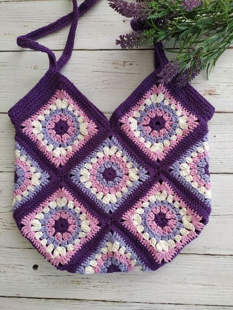 knitted a crochet bag and a Granny Square Bag, it is a weekend bag for women.

Combination of purple harmonious colors. I knitted this motif bag with great love. 💖

You will add elegance to your clothes with this small bag that you will love to use in summer.
It is a light bag that you can easily use on weekends. Big Granny Square Pattern, Big Granny Square, Crochet Granny Square Bag, Festival Purse, Crochet Sweater Design, Purple Tote Bag, Cute Handbag, Amazing Crochet, Crochet Frog