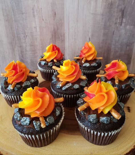 Chocolate cupcakes, camping theme birthday #campfire Cupcake Camping Theme, Campfire Theme Cupcakes, Fire Pit Cupcakes, Camp Cupcakes Ideas, Camping Theme Cupcake Ideas, 1st Birthday Camping Cake, Campfire Cupcakes Camping Birthday, Camp Kikiwaka Birthday Party, Camping Birthday Cupcakes