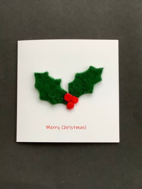 "A handmade needle felted Christmas card decorated with holly and berries.  this has been made by my 9 year old granddaughter, Grace, and this is reflected in the price. The card is approximately 5\" x 5\". The white envelope is 6\" x 6\" so that the card fits easily in the envelope. The card is packaged in a cellophane wrapper and posted via Royal Mail - in a cardboard backed envelope for protection. The card is left blank inside for your own message. This item is not suitable for small childre Needle Felt Cards, Felt Christmas Cards Handmade, Felted Christmas Cards, Needle Felted Christmas Cards, Felt Christmas Cards, Felted Cards, Felt Cards, Felting Pictures, Creative Christmas Cards