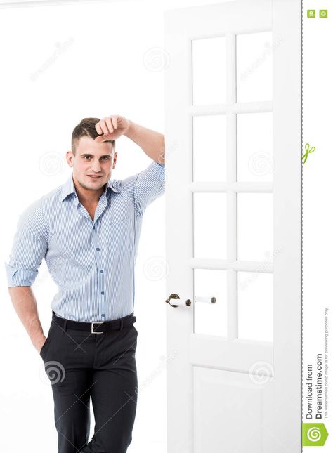 Portrait Casual Young Man Leaning Against The Frame Of An Open Door On Light Background Smiling And Looking To Camera Stock Photo - Image of clothing, door: 70342490 Man Leaning Against Door Frame Aesthetic, Men Leaning On Door Frame, Man Leaning On Door Frame, Leaning On Door Pose, Door Lean Pose, Leaning Against Door Frame Pose Drawing, Lean On Wall Pose Reference, Leaning In Doorway Pose, Man Leaning Against Wall Reference