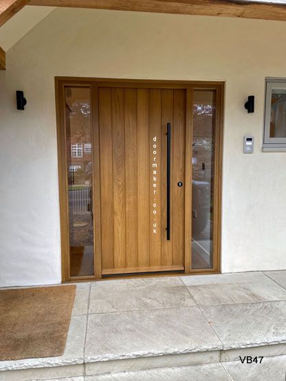 Modern Contemporary Front Doors, Wood Effect Front Door, Chalet Front Door, Japandi Style Front Door, Oak Front Door With Glass Side Panels, Entry Barn Doors, Oak Entrance Door, Wooden Front Door With Sidelights, Front Door Renovation Ideas