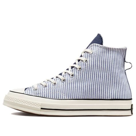 The Converse Chuck 70 High 'Washed Indigo Hickory Stripes' is a classic 1970s silhouette reimagined for today. Featuring a tapered toe and extra layers for added depth, this sneaker is perfect for everyday wear. The rubber sole provides comfort and durability, while the blue and white colorway adds a stylish touch. This sneaker is inspired by the original 1970s design and is sure to be a timeless classic. Whether you're running errands or going out for the night, the Converse Chuck 70 High is th Cute Converse, 1970s Design, Men's Converse, Blue Converse, Sneakers Converse, Shoe Wishlist, Sports Performance, Lifestyle Accessories, Cute Sneakers