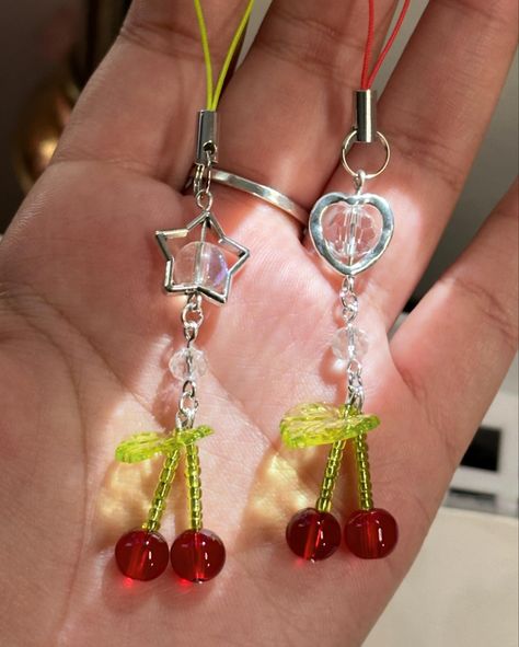 freshly harvested🍒✨ mini cherry phone charms Diy Phone Charm Strap, Aesthetic Phone Strap, Cute Phone Charms Ideas, Phone Charms Ideas, Beaded Keychain Ideas, Keychain Ideas Diy, Phone Charms Diy, Phone Charm Ideas, Diy Phone Charms