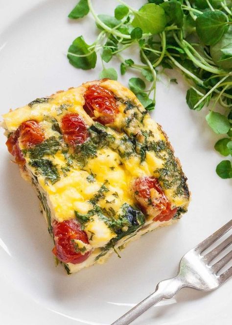 Frittata Squares with Spinach, Tomatoes, and Feta Recipe | SimplyRecipes.com Tomatoes And Feta Cheese, Tomato Frittata, Tomato And Feta, Tomatoes And Feta, Spinach Tomato, Frittata Recipes, Spinach And Cheese, Spinach And Feta, Quiche Recipes