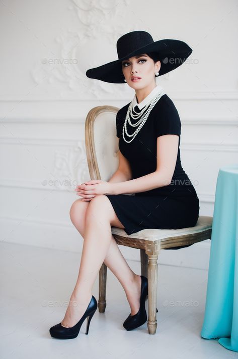 Elegant woman in black dress with a hat sitting on chair by romankosolapov. Elegant woman in black dress with a hat sitting on a chair.#black, #dress, #Elegant, #woman Pose Mannequin, Woman In Black Dress, Sitting Pose Reference, Woman In Suit, Chair Pose, Woman In Black, Pose Fotografi, Model Pose, Sitting Poses