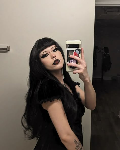 🦋 whitney 🦇 on Instagram: "the middle of adventure is such a perfect place to start 🥀 ××× @uniwigs discount code: whitney20 🖤 #uniwigs ××× ××× ××× ××× #hair #blackhair #wig #lacefrontwigs #alt #alternative #altstyle #emo #outfitoftheday #gothicaesthetic #gothic #gothgirl #darkaesthetic #style #fashion #altgirl #grungeaesthetic #ootd #goth #gothaesthetic #gothmakeup #darkmakeup #piercings #tattooedgirls #makeup #beauty #cosmetics #eyemakeup #tattoos" Curly Wig With Bangs, Afro Punk Fashion, Alt Makeup, Goth Hair, Dark Witch, Luscious Hair, Curly Hair Styles Easy, Goth Beauty, Creative Makeup Looks