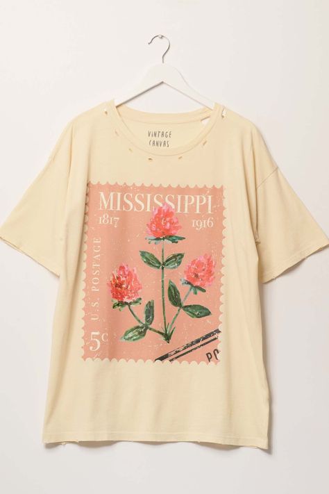 Distressed, mineral washed graphic t-shirt. Vintage-style graphic print of a Mississippi flower stamp. Torn and distressed detailing at neckline, cuffs, and hem. Round neckline. Short sleeves. Drop shoulder. Oversized fit. 100% Cotton. Imported top designed and printed in LA. Oversize Graphic Tee, Vintage Shirt Design, Spring T Shirts, Shirt Design Inspiration, Oversized Graphic Tee, Cute Graphic Tees, Graphic Tshirt Design, Graphic Tees Vintage, Flower Stamp