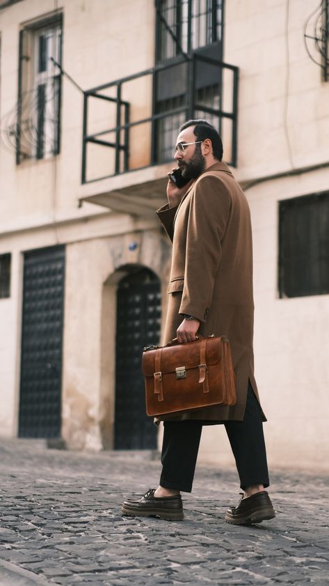 A man's briefcase can serve many functions. It is the vehicle the lawyer uses to organize and transport case files while away from the office. It's the carryall for the commuter who brings along his paperwork and computer. It's a fine alternative to the traditional backpack for the student with a sense of style. In short, a briefcase is the bag into which you can place all the various items you might need throughout the day. Because these items may include a laptop or tablet, your phone and wallet, sensitive documents, and other important sundries. You owe it to yourself to get the best briefcase for your personal needs. When you choose the right briefcase, you select an accessory that will make the tasks of your day. As an occasional rail commuter, I use a leather messenger bag style of b Cognac Satchel Briefcase For Business Trips, Brown Satchel Briefcase For Business Meetings, Professional Brown Briefcase For Work, Mens Laptop Bag, Mens Work Bags, Camel Leather Bag, Leather Business Bag, Mens Satchel, Vintage Briefcase