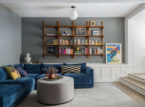 Living Room Couch Shelf, Shelves About Couch, Sofa With Bookshelf Above, Shelves Over Couch Living Room, Over Couch Shelf Decor, Bookcase Above Sofa, Books Above Couch, Ladder Shelves Next To Couch, Sofa Bookshelf Wall