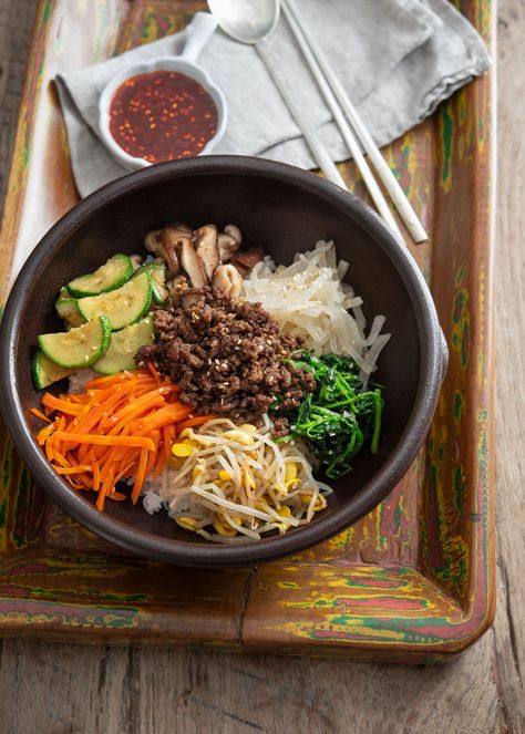 Various vegetables and ground beef bulgogi are arranged over rice in a stone bowl to make bibimbap Ground Beef Bibimbap, Easy Bibimbap, Ground Beef Bulgogi, Bulgogi Bibimbap, Beef Bibimbap, Dorm Meals, Bibimbap Sauce, Korean Rice Bowl, Mixed Rice