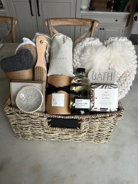 Luxury spa gift basket! Do you know someone who could use a little downtime? Check out our beautiful luxury, spa gift basket filled with products to help you relax and unwind! Reusable woven storage basket contains lightweight Cotton throw blanket by Creative Woman , Lemo'n crocheted ballerina slippers with fur pom-pom and Sherpa lining ( one size fits all) Oh so cozy lavender and lilac bath and shower gel, agave and nectar Soap  bar, BATH pumice  stone, wooden nail brush, exfoliating bath pad, super cozy socks, large lavender sachet, 7 ounce heavenly scented lavender soy candle and beautiful handmade pottery trinket dish to store y trinkets and treasures.  Why give a perishable gift when you could give a gift basket fill with items for the recipient to use.  Include a gift message upon or Relaxation Gift Basket, Luxury Gift Basket, Spa Kits, Creative Gift Baskets, Spa Basket, Care Basket, Healing Journaling, Spa Gift Set, Gift Baskets For Women