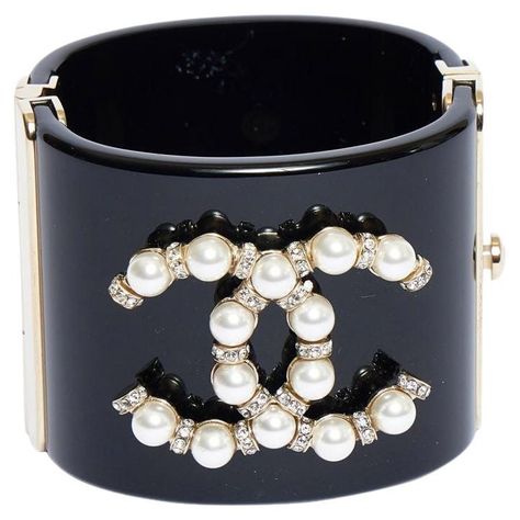 Chanel vintage black lucite cuff bracelet withPearl and clear rhinestones CC logo. Gold plated metal hardware. Mint condition. Original box included. Chanel Cuff, Vintage Chanel Jewelry, Pearl Logo, Chanel Bracelet, Diamond Cuff Bracelet, Chanel Logo, Chanel Accessories, Chanel Vintage, Chanel Jewelry