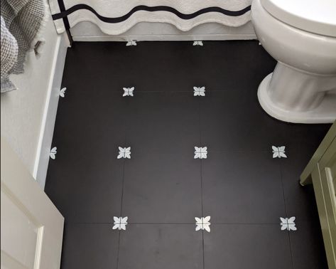 The 10 Best Painted Tile Floor DIYs We’ve Ever Seen Painting Tiles Black And White, Painting Exterior Tile Floors, Painted Concrete Laundry Room Floor, Painted Floor Tile Ideas, Painting Porcelain Tile Floor, Painting Kitchen Tile Floor, Paint Floor Tile Diy, Diy Bathroom Floor Peel And Stick, Painting Tiles In A Bathroom