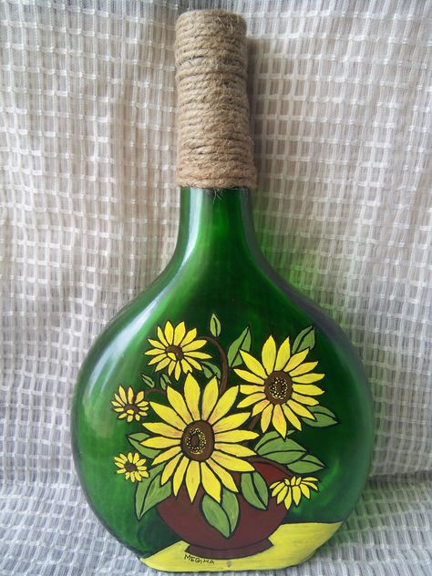 Acrylic painting on bottle...The bottle is painted with acrylic paint and the jute twine around the neck of the bottle gives it  a rustic look. This can be used as home decor. Green Bottle Painting, Glass Bottle Painting Acrylics, Painting On Bottles, Beer Bottle Art, Beer Bottle Crafts, Bottle Paint, How To Paint Flowers, Easy Yarn Crafts, Painting Glass Jars