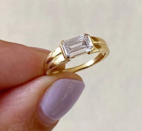 East To West Emerald Cut Moissanite Engagement Ring, Solitaire Half Bezel Double Row Band Ring, Daily Wear Ring, Gift For Her, 14K Gold Ring Item Description: Stone - Moissanite & Simulated Diamond Shape-  Emerald Cut  1. White Gold: 10K/14K/18K 2. Yellow Gold: 10K/14K/18K 3. Rose Gold: 10K/14K/18K 4. Silver: Sterling Silver 925 Size Customization: What Size you want... * You can also Customize ring size in US 4 to US 12! It sometimes affects to price. * Main Stone & Shape Customization: Main Stone: Cubic Zirconia, Moissanite, Natural Diamond, CVD Diamond Shape Choice: Round Cut, Heart, Princess Cut, Pear Cut, Cushion Cut, Marquise, Oval Shape, Asscher, Emerald, Radiant, Old European Cut, Old Mine Cut * Check out Special Notes: At checkout, leave us a note in the message box for the Ring s Diamond Index Finger Ring, Double Band East West Ring, Horizontal Ring Engagement, Sideways Rectangle Engagement Ring, Horizontal Wedding Ring, Sideways Emerald Engagement Ring, Thick Band Engagement Ring Gold, East West Emerald Engagement Ring, Unique Timeless Engagement Rings