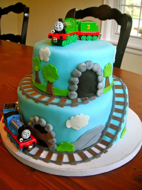 I made this for my 3 year old cousin who loves trains. all fondant decorations except trains. I bought the train toys online. 3 Yo Birthday Cake, Cake Ideas For 4 Year Boy, Birthday Cakes For 3 Year Boy, Cakes For 4 Year Boy, Four Year Old Birthday Cake, Cake For 5 Year Boy, Cake For 4 Year Boy, Cake For 3 Year Boy, Thomas The Train Birthday Cake