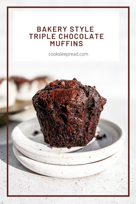 A cut view of the inside of a triple chocolate muffin on a stack of plates. Triple Chocolate Mini Muffins, Chocolate Muffins Bakery Style, Best Chocolate Muffins Moist, Bakery Style Double Chocolate Muffins, Choc Muffins Recipe, Moist Chocolate Muffins Recipe, Triple Chocolate Muffins Recipe, Jumbo Chocolate Muffins, Jumbo Bakery Style Muffins