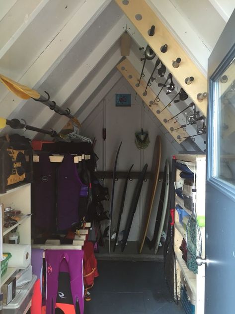 Storage Ideas For Boathouse, Water Ski Storage Rack, Lake Towel Storage, Beach House Storage Shed, Boat Shed Storage, Lake House Fishing Decor, Lake Shed Storage Ideas, Fishing Shed Ideas, Lake House Storage Room