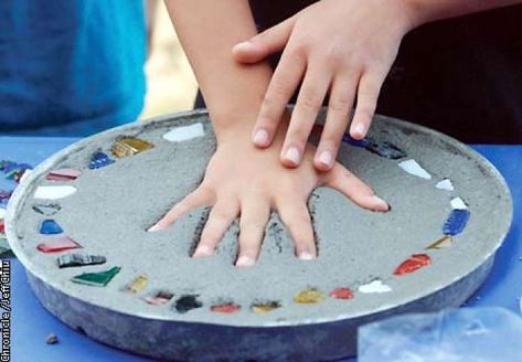 Jonathan, 9, imprints his hand as a finishing touch as he makes an individual concrete stepping stone on Tuesday afternoon in San Jose. Photo by Jeff Chiu / The Chronicle. Photo: Jeff Chiu Stepping Stones Kids, Stepping Stone Molds, Concrete Stepping Stones, Stepping Stones Diy, Mosaic Stepping Stones, Stone Molds, Garden Stepping Stones, Garden Steps, Concrete Steps