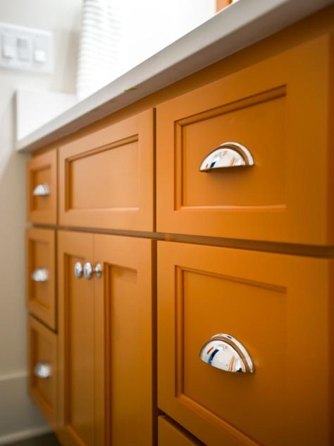 Would you dare to paint your cabinets pumpkin spice orange? See this room on HGTV.com. (http://photos.hgtv.com/photo/contemporary-white-and-burnt-orange-vanity?soc=Pinterest) Burnt Orange Kitchen, Orange Cabinets, Orange Kitchen Decor, Orange Bathroom Decor, Orange Bathrooms, Orange Kitchen, Contemporary Vanity, Basement Bathroom, Bathroom Pictures