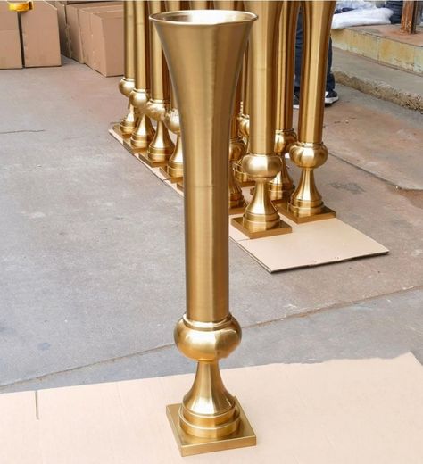 Add a touch of elegance to your wedding decor with this exquisite 100cm metal flower trumpet vase. The sleek and stylish shape of the vase complements any wedding theme. Made of high-quality metal this vase is sturdy and durable. The vase is perfect for displaying flowers, lights or other decoration items. It can be used as a standalone centerpiece or in combination with other vases. The vase is versatile and can be used for various occasions beyond weddings. Feature metal flower vase Quantity: 1 piece Overall Height: 39" Top Opening Diameter: 22cm Materials: Metal, acrylic. 39" tall darling soars sophistical from a narrowed stem to a relatively wider opening.  Choose the quantity  you need. If you order 2 pieces you will get 2 stands. Order 4 pieces, you will get 4 stands  and so on.  Mea Gold Flower Vases Wedding, Large Trumpet Vase, Large Gold Floor Vase, Great Gatsby Party Decorations Table Centerpiece Ideas, Fall Boho Wedding Reception Decor, Tall Gold Centerpiece Wedding, Gatsby Centerpiece Ideas, Tall Gold Vases, Gold Themed Wedding