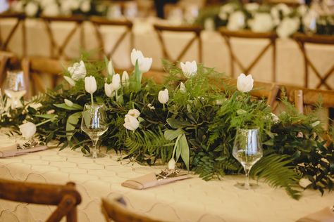 Green and white wedding flowers; landscape arrangement; white and green long and low arrangement; gold accents; white tulips; greenery arrangement; long table centerpieces; farm style tables; The Press Room; JoPhoto White Table Specialty Linen   Lisa Foster Floral Design   www.lisafosterdesign.com Long Table Floral Arrangements, Long And Low Flower Arrangement, Long And Low Arrangement, White Wedding Table Decor, Green And White Wedding Flowers, Long Table Centerpieces, Olive Foliage, White Flower Centerpieces, Farm Style Table