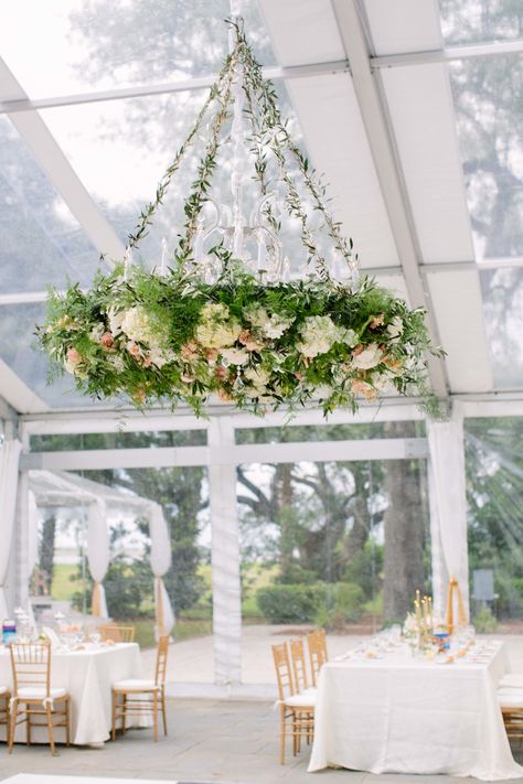 You can barely see the chandelier itself in this instance, but since the bulbs aren't covered, it'll still do its job. Boutique Planning worked with Branch Design Studio, who covered the classic fixtures in this clear-topped tent in a unique way. Floral Chandelier Wedding, Wedding Ceremony Ideas, Wedding Chandelier, Flower Chandelier, Floral Chandelier, Diy Chandelier, Scottish Wedding, Hanging Flowers, Salou