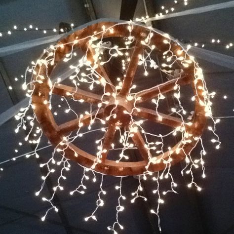 Wagon wheel for a country wedding! http://moodstruck.com/clear-lights-50.html Western Prom Decorations, Wagon Wheel Wedding Decor, Rustic Romance Prom, Chandelier Projects, Prom Western, Cowboy Prom, Jojo Wedding, Western Prom, Wagon Wheel Light