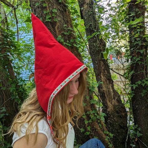 Whimsical and fun handmade pixie hats, the perfect accessory for adding a touch of magic to your winter wardrobe. These unique triangular-shaped hats are made of red cotton corduroy and lined with soft cotton flannel. Reversible and trimmed with playful woven jacquard ribbon ties, these hats are perfect for a Halloween costume or everyday dress up.  The two sets of snaps at the chin ensure a secure fit, with no ties or bows to fuss with. Whether you want to dress up as a fairy, gnome, or elf, th Gnome Cosplay, Garden Gnomes Costume, Gnome Costume, Costume Toddler, Girl Elf, Red Garden, Gnome Hat, Pixie Hat, Hair Wreath