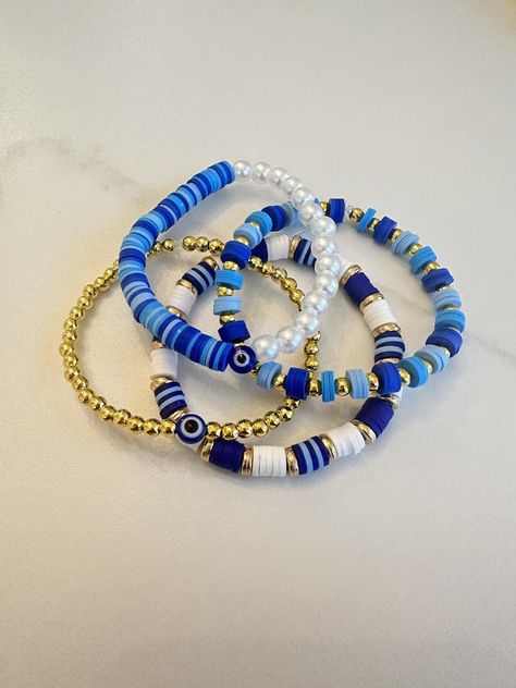 Blue and gold clay bead bracelet collection. Star Clay Bead Bracelet, Navy Blue Clay Bead Bracelets, Dark Blue Clay Bead Bracelet, Bracelet Ideas Clay Beads Aesthetic, Cool Clay Bead Bracelet Ideas, Clay Bracelet Idea, Clay Bead Bracelets For Boys, Clay Beads Aesthetic, Clay Bead Brackets