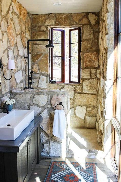 Some of the chicest city bathrooms feature rustic accents, and they don't sacrifice modernity for texture and character. Here are some of our favorite ways to incorporate the tile in your space. #hunkerhome #bathroom #shower #rustic #rusticshowerideas Rustic Shower Tile, Rustic Cottage Bathroom, Cottage Bathroom Ideas, Rustic Shower, Stone Shower, Stone Bathroom, Cottage Bathroom, Rustic Stone, Shabby Chic Bathroom