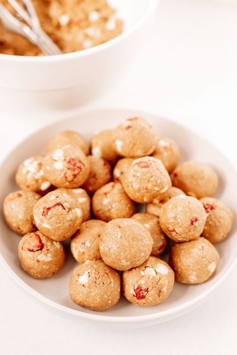 Strawberry Cheesecake Protein Balls | From the Roots Strawberry Protein Balls Healthy, Herbalife Strawberry Cheesecake Protein Balls, Strawberry Cheesecake Protein Balls, Strawberry Shortcake Protein Balls, Fruity Pebble Protein Balls, Strawberry Cheesecake Protein Shake, Strawberry Protein Balls, Cheesecake Protein Balls, Energy Recipes