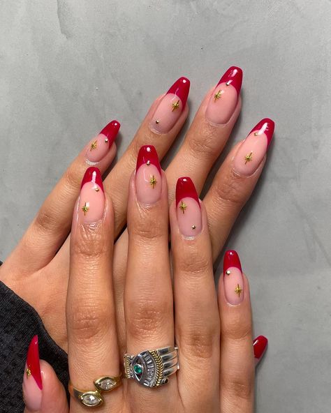 Posted by Zoe Scott: Hello, trend-savvy souls! As the holiday season sweeps in with its glittering wave of festivities, the fashion landscape bursts into a kaleidoscope of... Almond Nail Designs Simple, Trending Red Nails, Red And Gold Nail Ideas, Christmas Nails Red Glitter, Gold And Red Nails, Gold Star Nails, Red And Gold Nail Designs, Gold Nail Ideas, Greece Nails