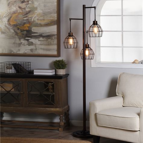 This steel floor lamp incorporates a vintage inspired style to create a distinctly modern look. A three light design, it uses a tall single bar design with three wire shades to create a graceful and elegant form. Origami Lamps, Farmhouse Floor Lamps, Spencer House, Rustic Floor Lamps, Bronze Floor Lamp, Tree Floor Lamp, Rustic Flooring, Industrial Floor Lamps, Floor Lamps Living Room