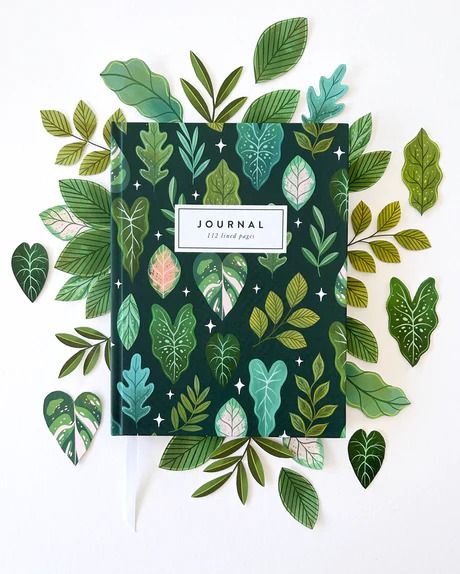 Our "Tropical Leaves" Pattern covers our new Hardcover Notebooks with a deep jungle vibe. This Journal feels cozy and wild at the same time, with plenty of pages to explore your thoughts and dreams. Illustrated leaves of all variety wrap around the entire journal, including the spine, making this journal a gorgeous gif Handmade Stationary, Deep Jungle, Notebook Cover Design, Tropical Leaves Pattern, Dot Grid Journal, Place Holder, Stationery Inspiration, Ruled Paper, Cute Notebooks