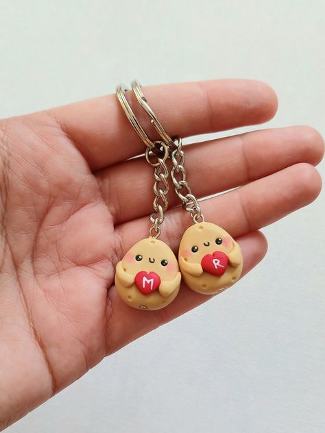 Cute potato keychains for best friends or couples. The charms measure about 2 cm and are made by hand, from polymer clay. Since we do not use molds or forms, the models may slighly vary from the picture. You can order one keychain or a set of more keychains. Please fill the desired letters with your order. * Each product comes in a cute packaging. * Visit our shop to see all the products: https://www.etsy.com/shop/nahootdesignshop/?etsrc=sdt Bsf Matching Keychains, Best Friends Clay Ideas, Couple Keychains Clay, Matching Crafts For Friends, Couple Clay Keychain, Clay Keychain Diy Best Friends, Clay Gift For Boyfriend, Couples Clay Ideas, Air Dry Clay Ideas For Boyfriend